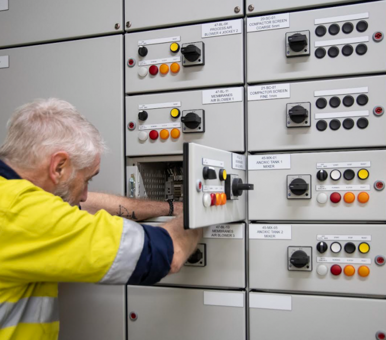 Kinetic Electrical technician working on an industrial switchboard