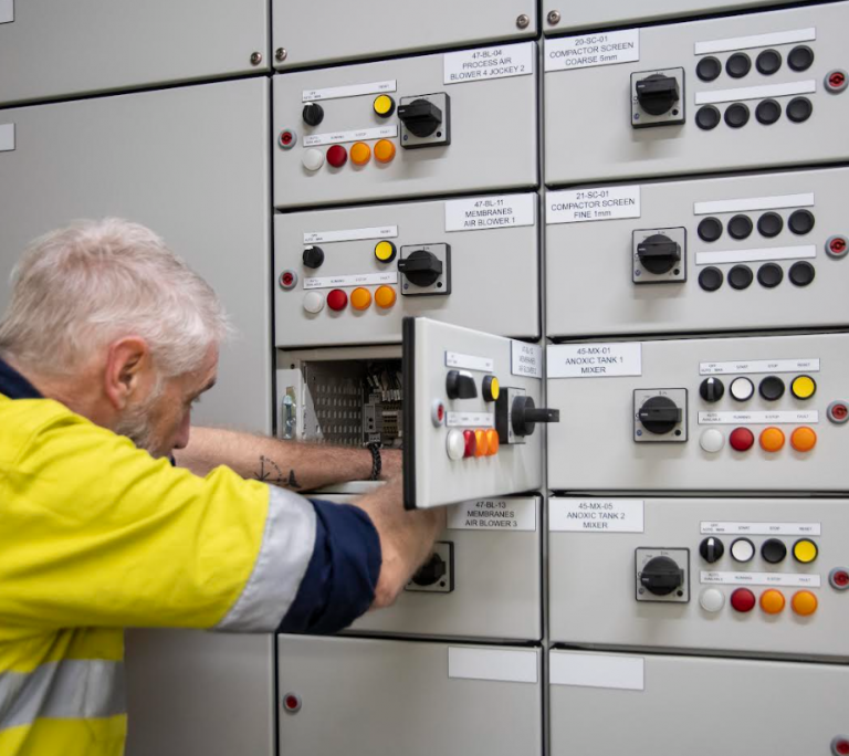 Kinetic Electrical technician working on an industrial switchboard