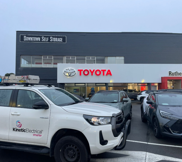 Kinetic Electrical Wellington vehicle and team onsite at a commercial property