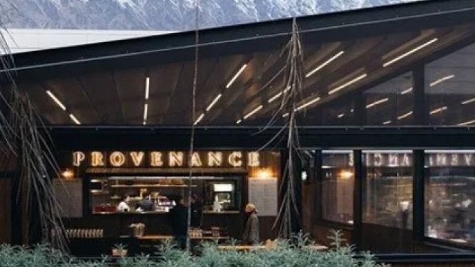 Exterior of Provenance Café courtyard at Queenstown Airport with the Remarkables behind it