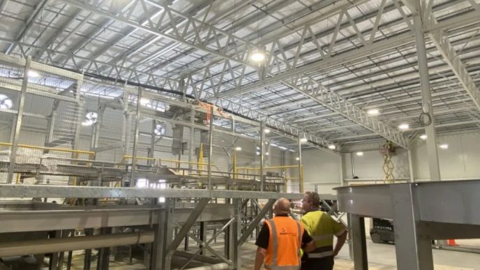 Kinetic Electrical team members inside the automated T&G apple packhouse in Hawke’s Bay